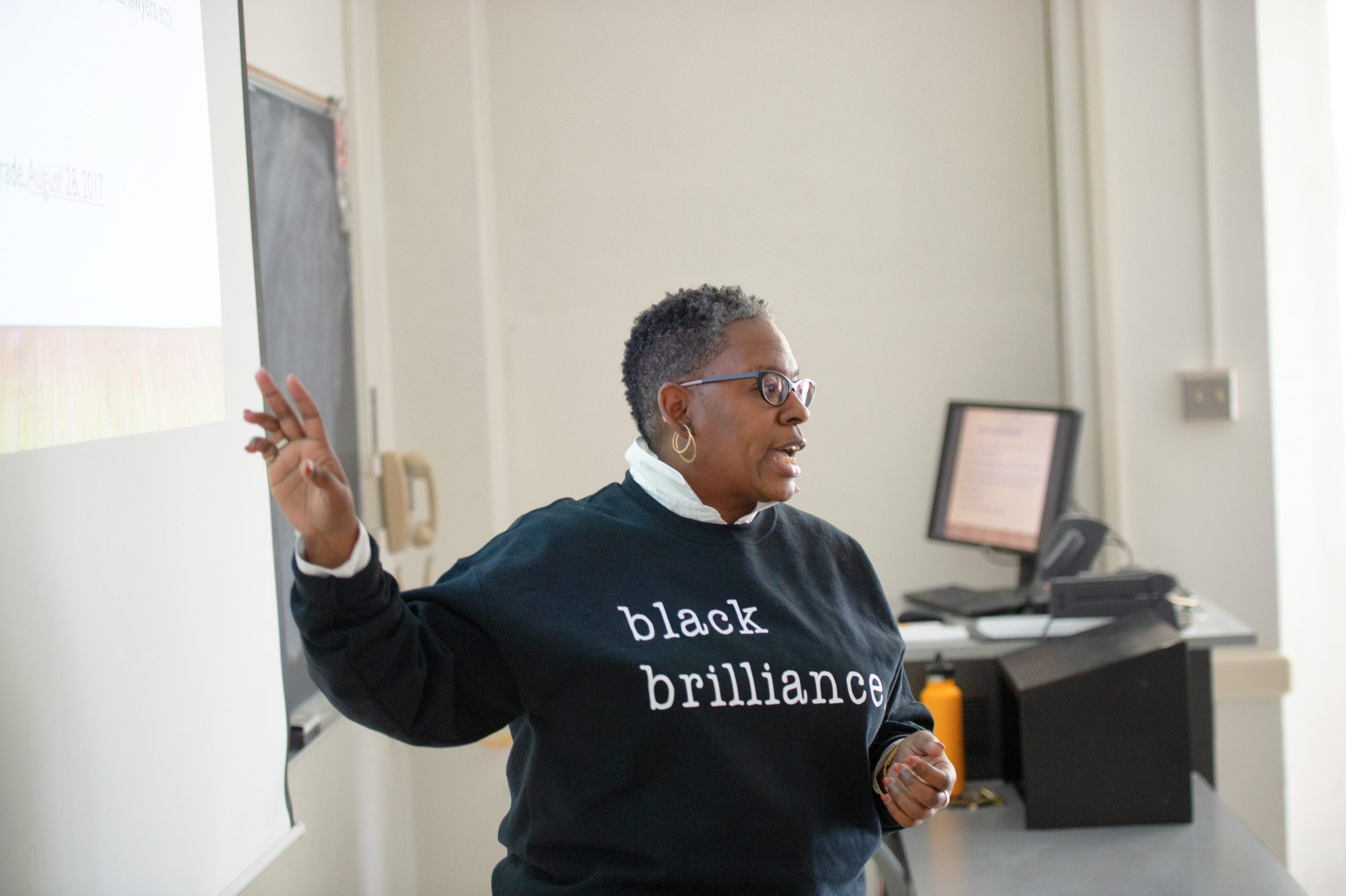 Social Work Clinical Assistant Professor Yolanda Spears teaching at the front of a classroom.
