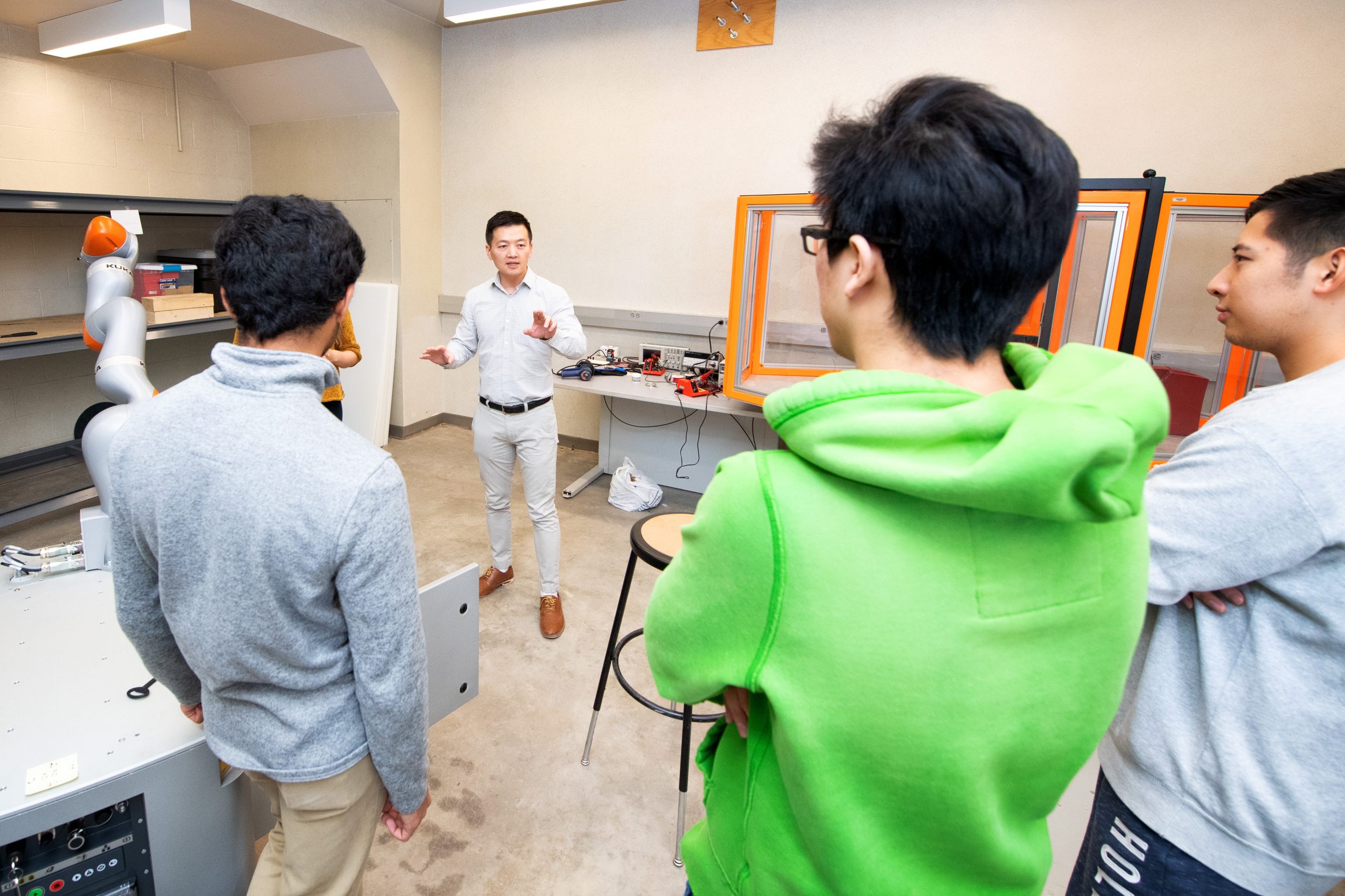 Associate Professor Shaoping Xiao providing a Kuka robot demonstration.