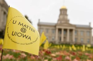 U Matter @ UIOWA flag in grass in front of the Old Capitol Building =