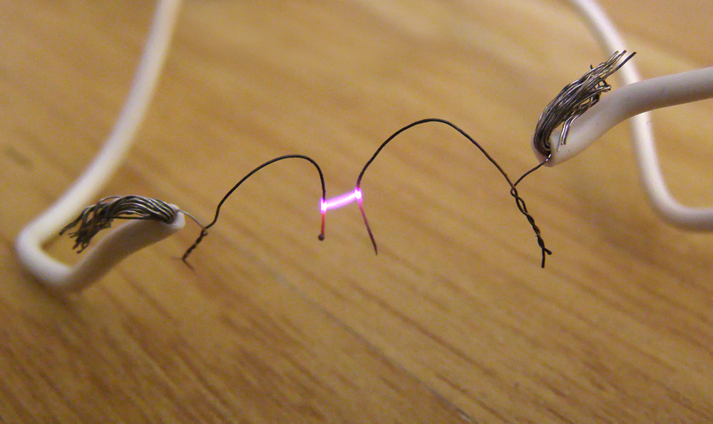 Photograph of an electric arc produced between two multi stranded wires close to each other but not in contact.