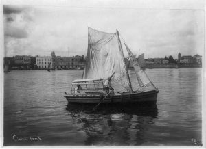 Two men in sailboat in Havana harbor