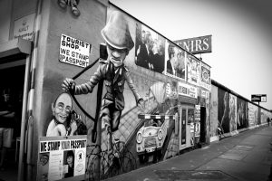 A picture of the Berlin Wall with various graffiti