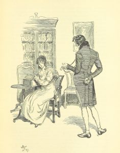 A woman sitting at a desk opening a box, while a man stands near her, speaking and looking at a pocketwatch